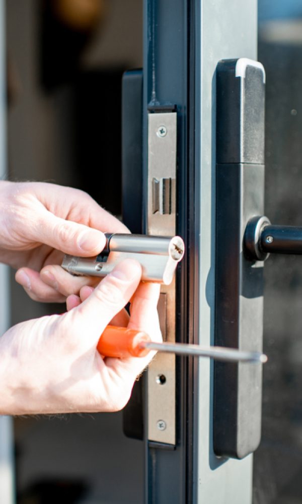 Man,Changing,Core,Of,A,Door,Lock,Of,The,Entrance