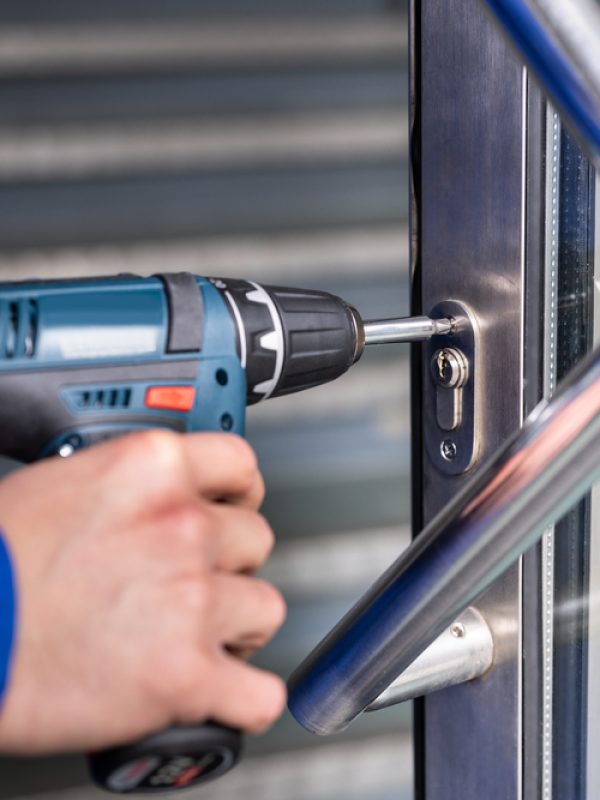 Locksmith,Man,Repairing,And,Changing,Metal,Door,Lock